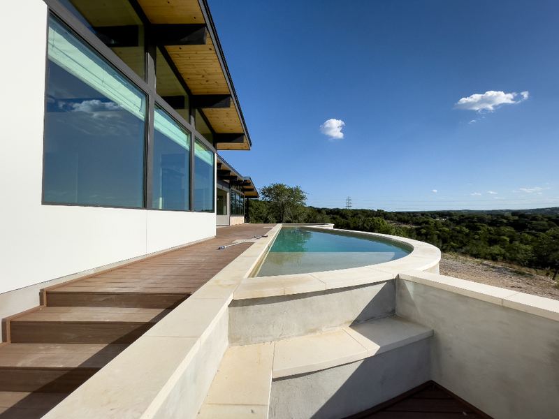 Terrace with a pool overlooking a valley