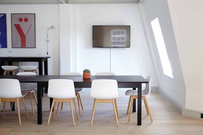 Minimal dining room with white chairs